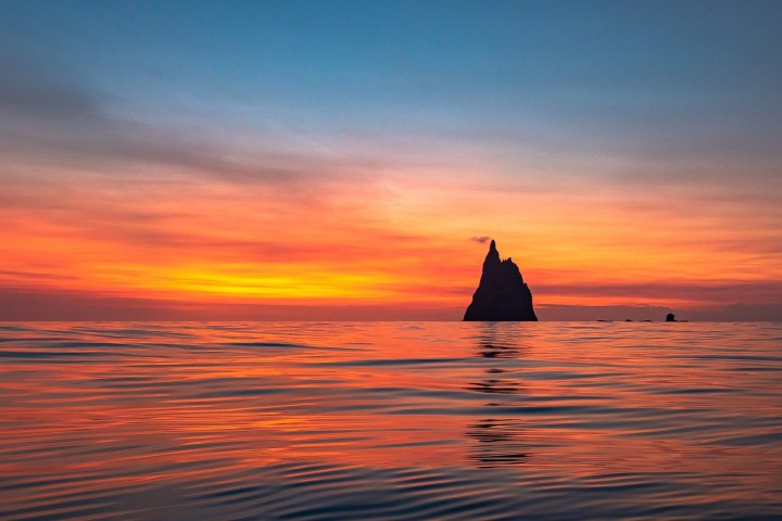 a sunset over a body of water