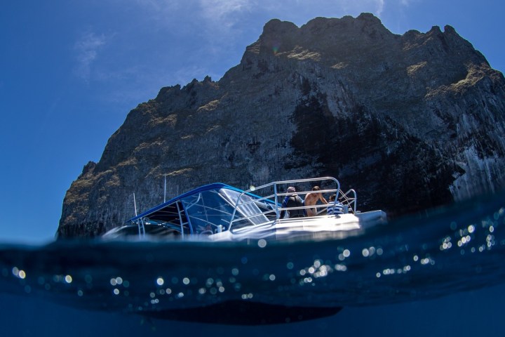 a boat floating on top of a mountain