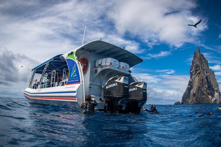 a small boat in a large body of water