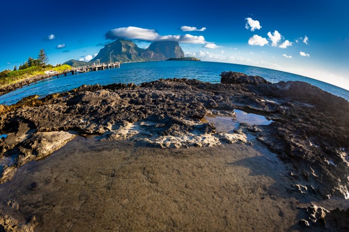 a rocky beach next to the ocean