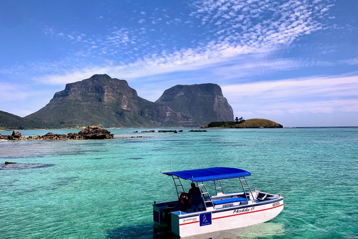 a small boat in a body of water