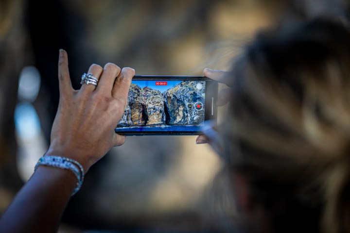 a hand holding a cellphone